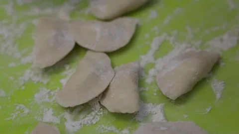 Close up of hands making traditional homemade dumplings with cottage cheese Stock Footage 333908970