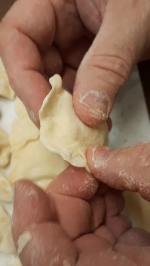 Close-up of hands making traditional potato dumplings Stock Footage 328247661