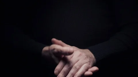 Close-up of hands, a man applauds on a black background Stock Footage 120065139