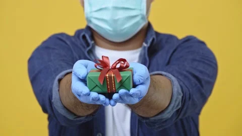 Close up hands man is celebrating New Year and Christmas and sending the gift bo Video stock 145130183