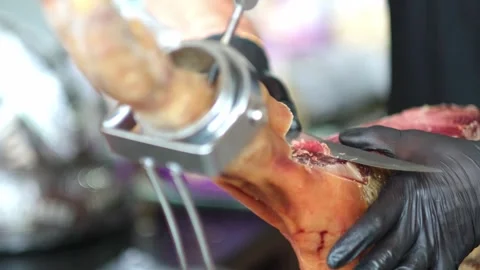 Close up of hands man Chef cutting Extra quality dry-cured spanish ham Jamon Video stock 279551468