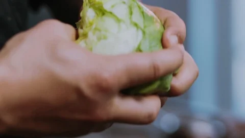 Close up hands man chef hold cook shares the cabbage cutting salad vegetarian Stock Footage 100303272