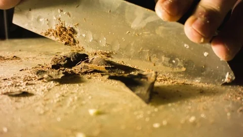 Close-up hands of man chopping chocolate 스톡 동영상 79775835