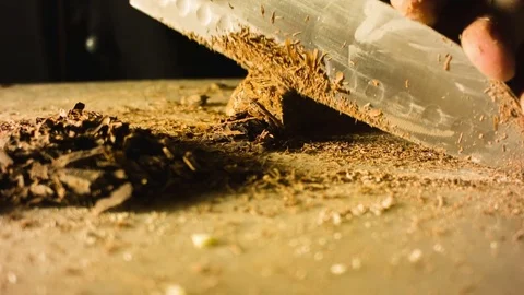 Close-up hands of man chopping chocolate Видео 79813871