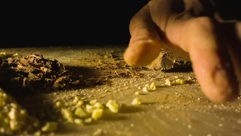 Close-up hands of man chopping chocolate Video stock 79818079