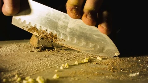 Close-up hands of man chopping chocolate Video stock 79818126
