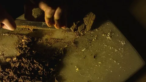 Close-up hands of man chopping chocolate Stock-Footage 79818732