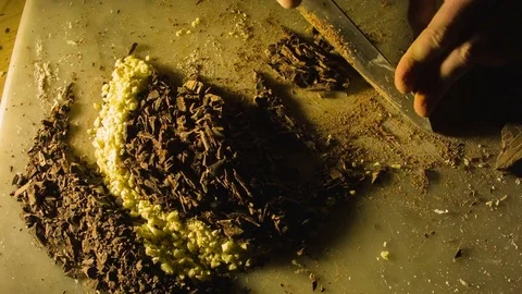 Close-up hands of man chopping chocolate 動画素材 79818743