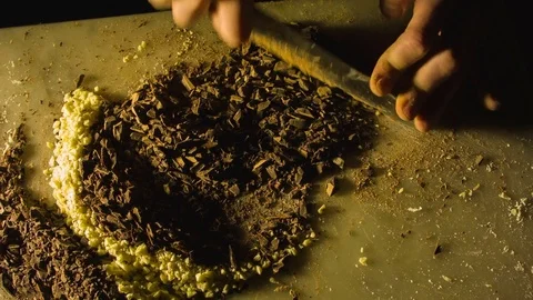 Close-up hands of man chopping chocolate 스톡 동영상 79818751