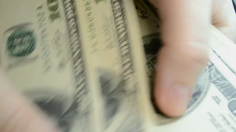 Close Up Of Hands Of An Man Counting Hundred Dollar Bills At A Table Stockbeeldmateriaal 95247774