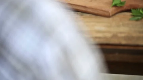Close-Up Of  Hands Of Man Cutting Tomatoes On A Wooden Board Stock Footage 93387679