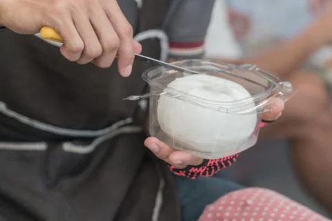 Close up The hands of man decorating coconut meat sale. Stock Photos