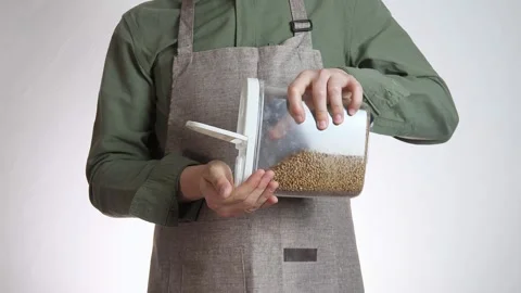 Close-up of the hands of a man in a gray apron or a cook Stock Footage 310201347