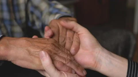 Close-up in the hands of a man the hands of an elderly person. Love for parents, Stock Footage 211725057
