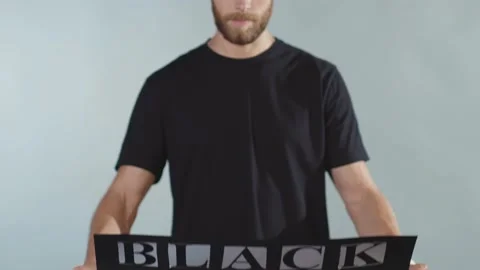 Close up hands man hold poster Black Lives Matter racial morality society peace Stock Footage 133637442