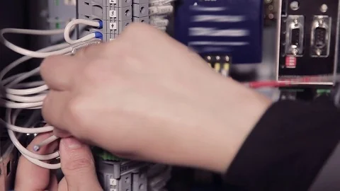 Close-up of hands of man holding screwdriver and wires. Stock-Footage 77007138
