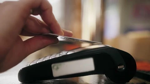 Close up hands of man making payment with credit card machine terminal 库存影片 141419507