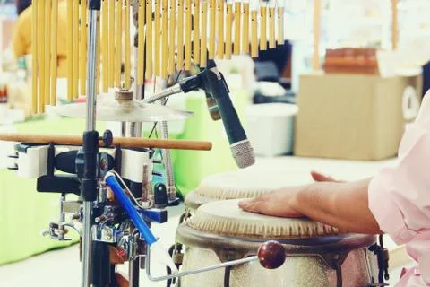 Close up of hands of a man playing a drum percussion Stock Photos
