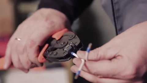 Close-up of hands of man preparing wires to work. Stock-Footage 77007043