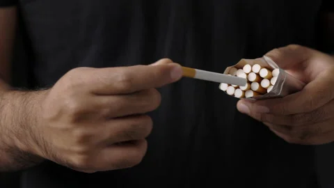 Close up hands man pulled out a cigarette from the pack and was about to smoke.  Stock Footage 152765101