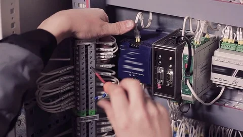 Close-up of hands of man screwing wires. Stock-Footage 77006913