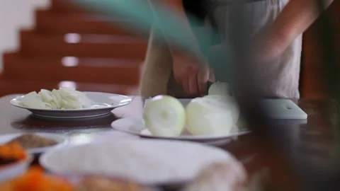 Close-up of hands of a man taking a cutting board in the kitchen and throwing Stock Footage 256058309