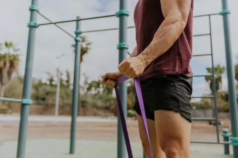 Close up of the hands of a man training with resistance Stock Photos
