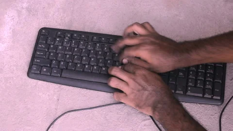 Close up hands of man typing on keyboard. man enjoying typing on keyboard.poor m Stock Footage 132001100