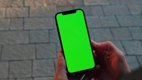 Close up hands man use phone with vertical green screen stand on street outdoors Stock Footage 145850722