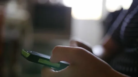 Close up hands of a man using green touchscreen phone Stock Footage 64093598
