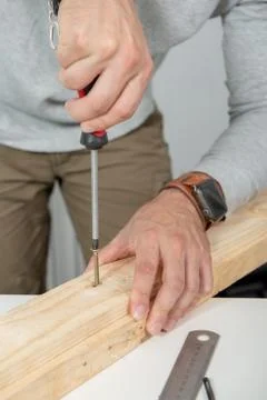 Close up of hands of  man using screwdriver Stock Photos