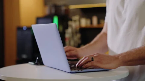 Close-up of the hands of a man who is typing on a laptop in the office Stock Footage 219460230
