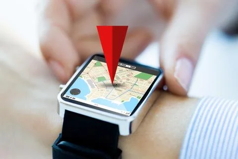 Close up of hands with map on smartwatch screen Foto stock