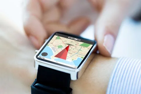 Close up of hands with map on smartwatch screen Foto stock