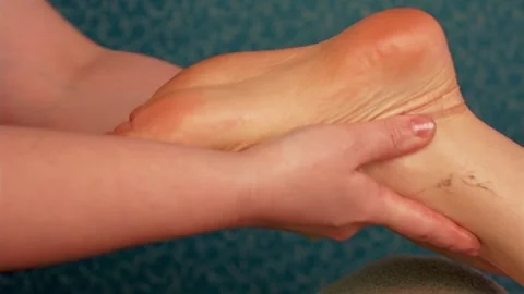 Close up hands of massage doing foot massage to girl Stock Footage 303089063