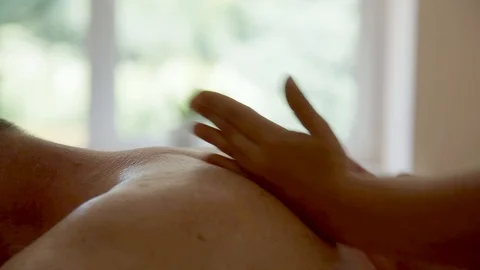 Close-up of the hands of a massage therapist. Wellness treatments Stock Footage 123728557