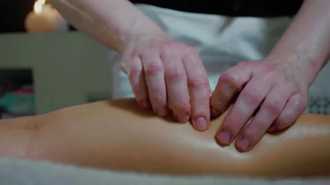 Close-up of hands of masseur doing foot massage. Foot massage close up. Video stock 140135675
