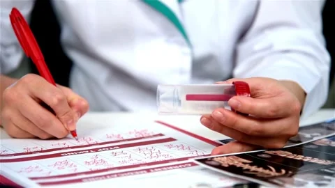 Close up hands medical practitioner take notes life insurance Doctor hospital, Stock-Footage 336587994