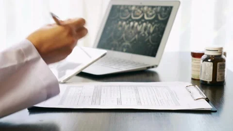Close up hands medical practitioner take notes life insurance Doctor hospital, Stock-Footage 336588190