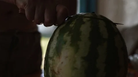 Close-up, Hands of Men Cut with a Ripe Knife Ripe Watermelon Stock Footage 88199010