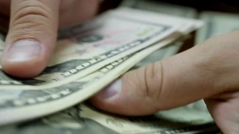 Close-up of hands meticulously counting hundred dollars bills. Cash money B.. Stock Footage 266474648