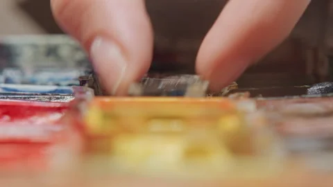 Close up hands mixing and selecting oil paints from detailed artist color Stock Footage 345068672