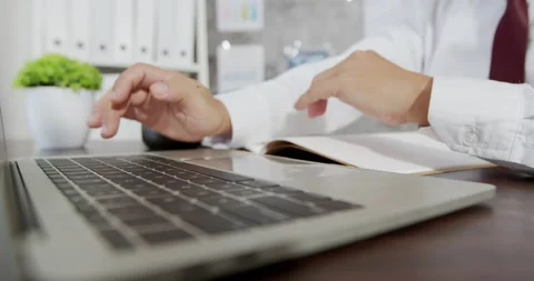 Close up hands multitasking business man using laptop Stock Footage 138929848