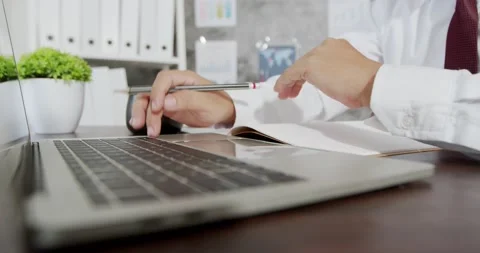 Close up hands multitasking business man using laptop Stock Footage 139956619