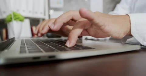Close up hands multitasking business man using laptop and typing work Stock Footage 139956642