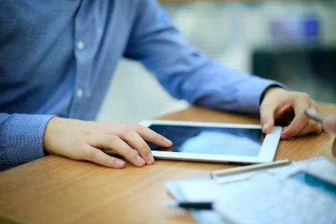 Close up hands multitasking man using tablet, laptop connecting wifi Stock Photos