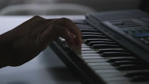 Close-up hands of Musician practicing keyboard playing in a studio. Piano keys Stockbeeldmateriaal 176897189