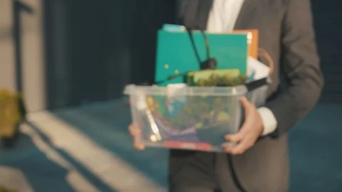 Close up hands of office worker man holding box of personal stuff lose a job got Stock Footage 129463819
