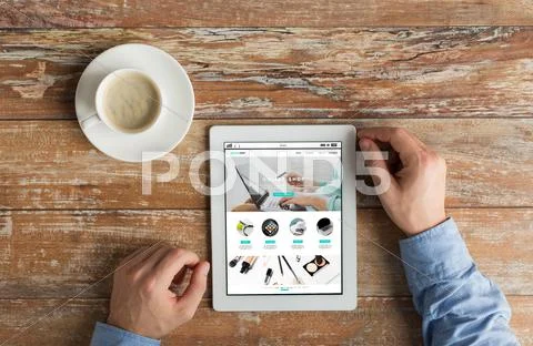 Close up of hands with online shop on tablet pc Stock Photos