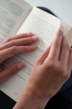 Close up hands with open book for reading concept Stock Photos